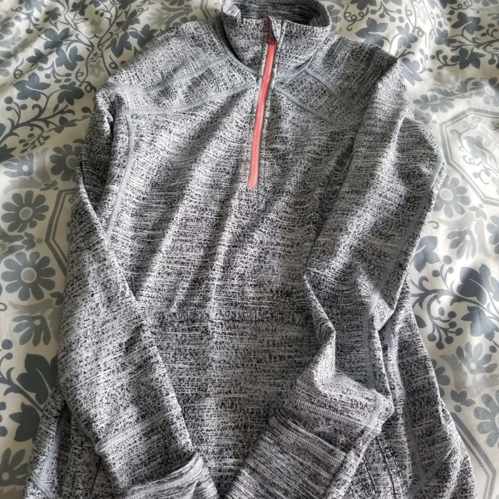 Black and white  Ivivva pullover.  Size 12.  Looks like it was never worn.
